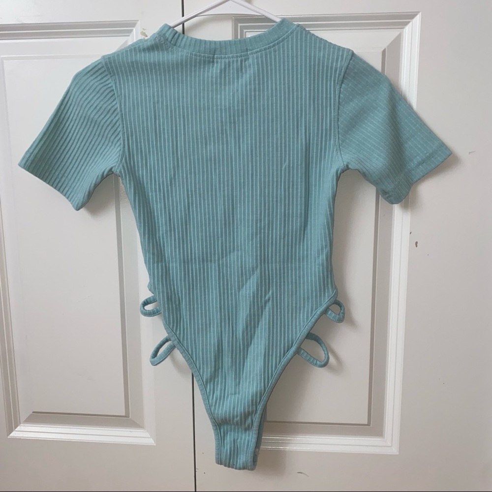 Pretty little thing - blue bodysuit - size 4